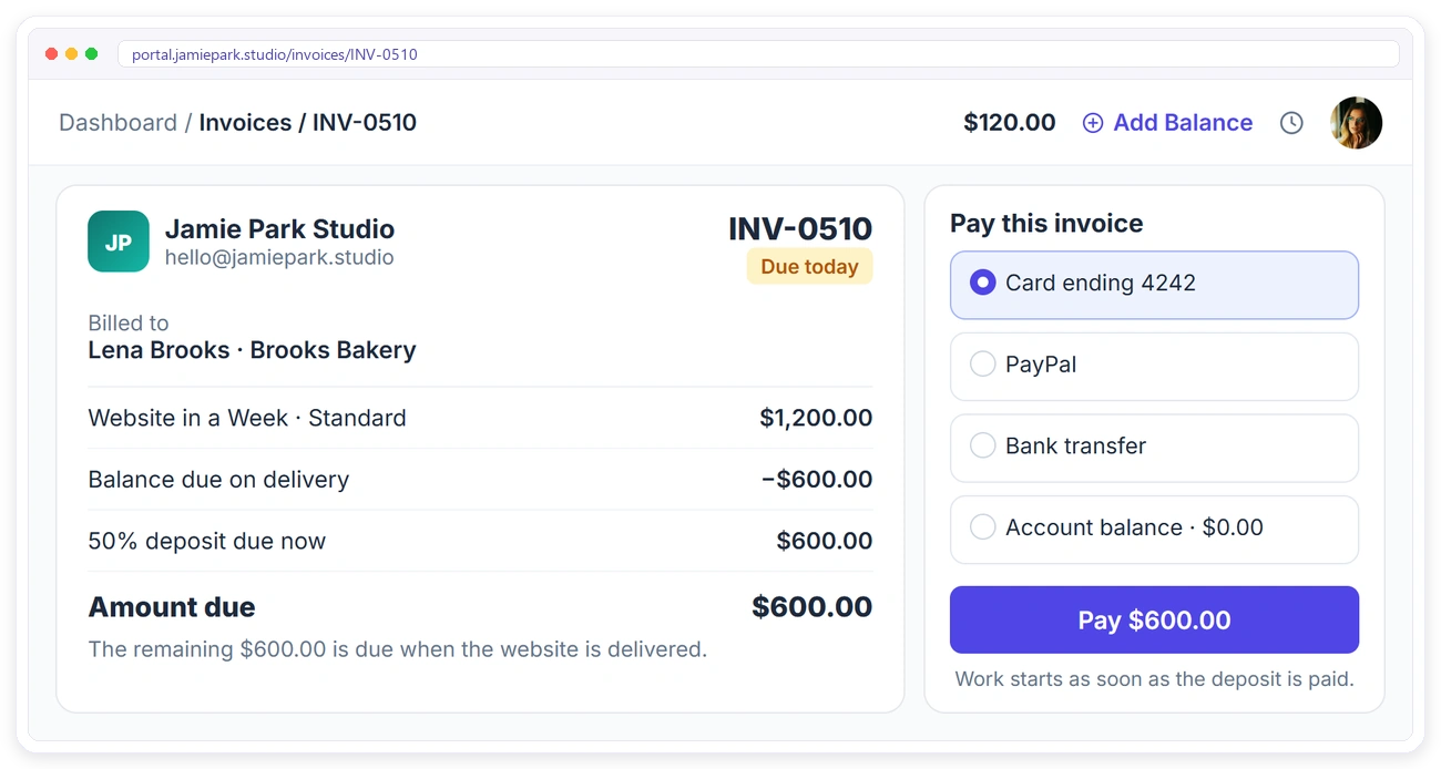 A client paying a freelancer's 50% deposit invoice by card in the Clientish client portal before work starts